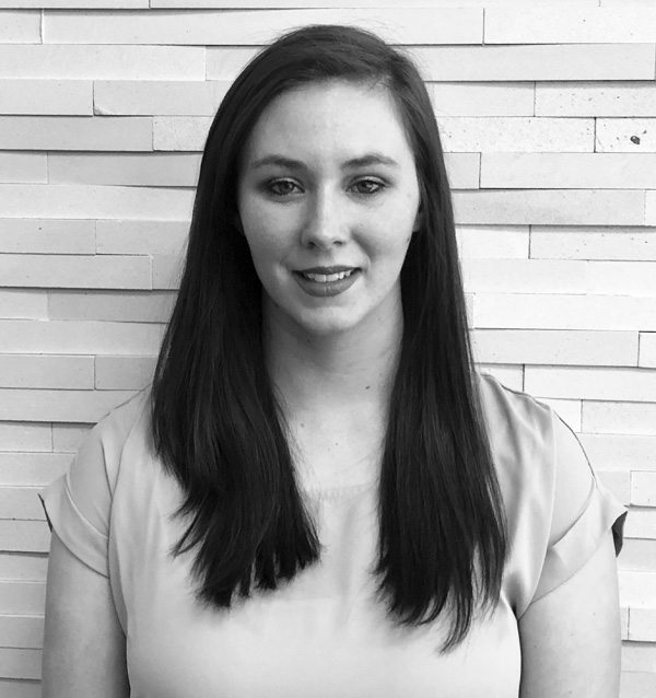 black and white headshot of smiling woman